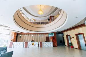 a large lobby with a large circular ceiling at Gold Crest Hotel in Mwanza