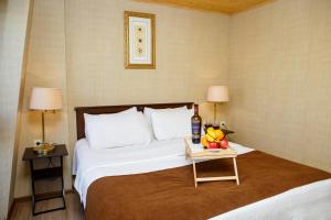 Postel nebo postele na pokoji v ubytování Grand Arc Hotel