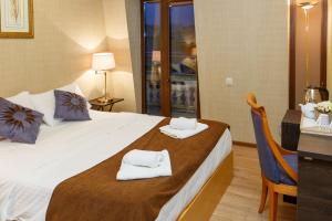 Postel nebo postele na pokoji v ubytování Grand Arc Hotel + 14 fotografií