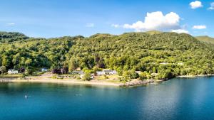 an island in the middle of a body of water at Onich Hotel & Lochside Beach Pods in Onich
