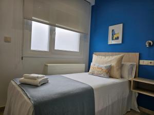Inicia AVIO Apartamentos tesisinde bir odada yatak veya yataklar
