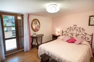 Postel nebo postele na pokoji v ubytování B&B Il Chiostro Assisi