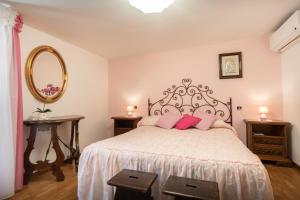 Postel nebo postele na pokoji v ubytování B&B Il Chiostro Assisi