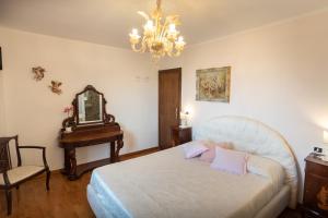 Postel nebo postele na pokoji v ubytování B&B Il Chiostro Assisi