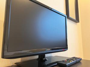 TV a/nebo společenská místnost v ubytování Shinjuku Sun Park Hotel