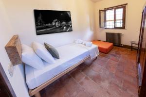 Postel nebo postele na pokoji v ubytování Frantoio Del Moscatello