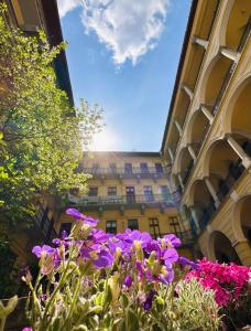 a building with purple flowers in front of it at The Spot with Green Chair - cozy space near Danube in Budapest