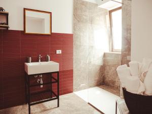 a bathroom with a sink and a shower at U Zuccareddu in Alcamo