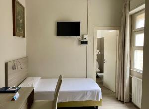 TV a/nebo společenská místnost v ubytování Hotel Bazzoni