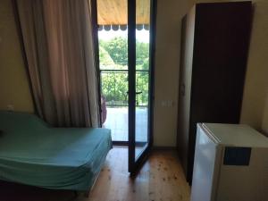 Ένα ή περισσότερα κρεβάτια σε δωμάτιο στο Valdi Guest Shekvetili