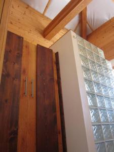 a room with two wooden cabinets and a window at Towerhouse - Modern Cabin @ 8,000ft in Wanship