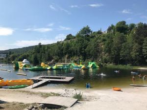 a group of boats in a body of water at Riverside Bliss Idyllic Camp, 3 Man Tent Incl, near Tvedestrand and Arendal in Vegårshei