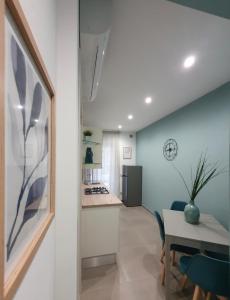 a kitchen and dining room with a table and a dining room at Playa degli Angeli Grecale in Gabicce Mare