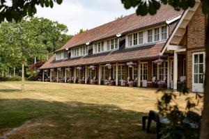 Κήπος έξω από το Landhuishotel De Bloemenbeek