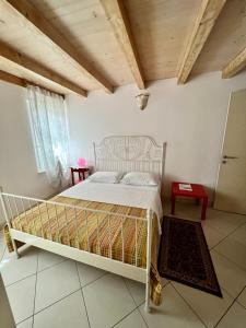 Postel nebo postele na pokoji v ubytování B&B La Pitagora