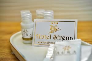 a bottle of moisturizing moisturizers on a plate with a label at Sirena Suite Deluxe in Peschici