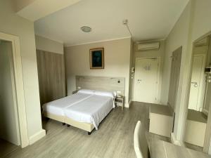 Postel nebo postele na pokoji v ubytování Hotel Bazzoni