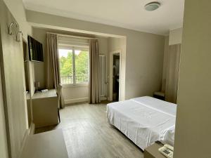 Postel nebo postele na pokoji v ubytování Hotel Bazzoni
