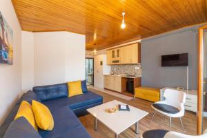 a living room with a blue couch and a table at Taksim full House in Istanbul