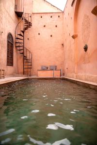 Bazén v ubytování Riad Ben Youssef nebo v jeho okolí