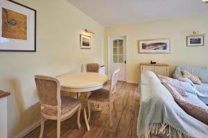 a living room with a table and a couch at Host & Stay - Sandpipers in Belford