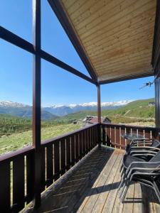 a view from the deck of a mountain house at Bjørgo Gard - Stegastein in Aurland