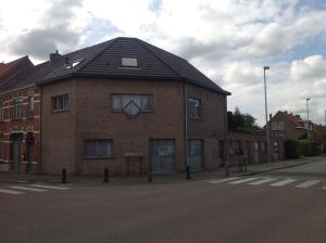 a brick building on the side of a street at Apartment Fruithof Tack in Sint-Gillis-Waas