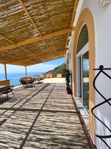 a balcony with a view of the ocean at Tenuta La Picola in Furore