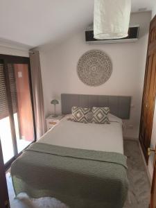 A bed or beds in a room at Sanpedro Apartamentos Marbella