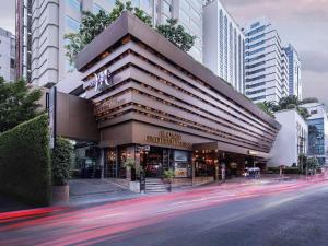 a building on the side of a street with buildings at Mercure Bangkok Sukhumvit 11 in Bangkok