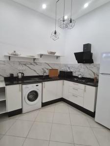Kuchyň nebo kuchyňský kout v ubytování Appartement Sable blanc + 2 fotografie