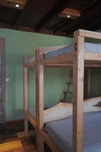 a couple of bunk beds in a room at The Pink House in Faja Grande