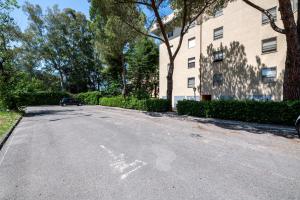 an empty street in front of a building at Homiday - New House - Pisa Aeroporto - Free Parking in Pisa
