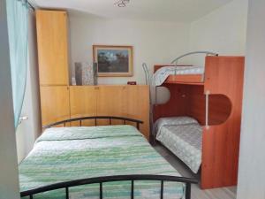 A bed or beds in a room at Fuga in montagna Casa indipendente mezzo montagna con barbecue