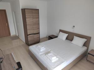 Postel nebo postele na pokoji v ubytování ARIA