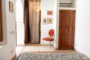 Postel nebo postele na pokoji v ubytování Riad Ben Youssef