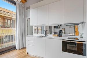 Kuchyňa alebo kuchynka v ubytovaní Apartamentos Casapalma Centro Histórico + 37 fotografií