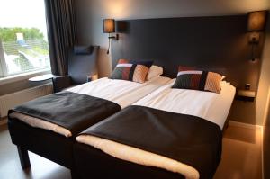 Postel nebo postele na pokoji v ubytování Zefyr Hotel