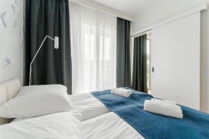 Postel nebo postele na pokoji v ubytování Apartament BIRDS SurfingBird Dźwirzyno