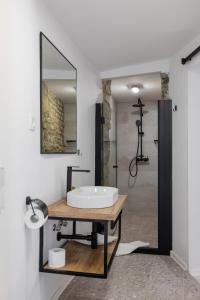 a bathroom with a sink and a mirror at B&B Miracolo di Mare Golden House in Piran