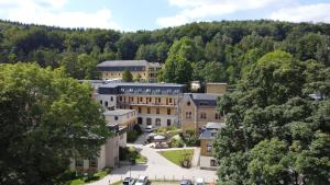 an aerial view of a building in a town with trees at Sächsisches Gemeinschafts-Diakonissenhaus ZION e. V. in Aue