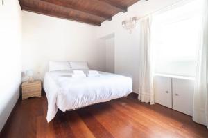 Katil atau katil-katil dalam bilik di Casa Playa Graña "Ferrol"
