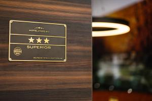 a wooden door with a sign that says superstar at Thermalhotel Kemper in Erwitte