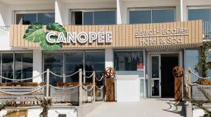a building with a sign that reads camporee on it at Hôtel Édenia - Spa Estime&Sens in Carnac