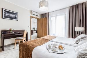 Posteľ alebo postele v izbe v ubytovaní Mercure Wiazowna Brant + 37 fotografií