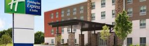 a building with a sign in front of it at Holiday Inn Express & Suites Atlanta South - Stockbridge, an IHG Hotel in Stockbridge