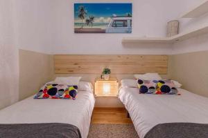 Postel nebo postele na pokoji v ubytování A&N La Vega 2 + 29 fotografií