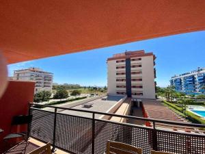 a balcony with a view of a building and a pool at A&N Spacious Family Retreat with Pool & Parking in Torre del Mar