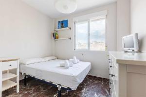 Posteľ alebo postele v izbe v ubytovaní A&N Xauen Torre del Mar