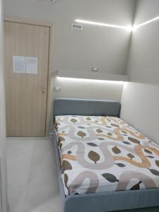 Postel nebo postele na pokoji v ubytování Residence PEGA B&B